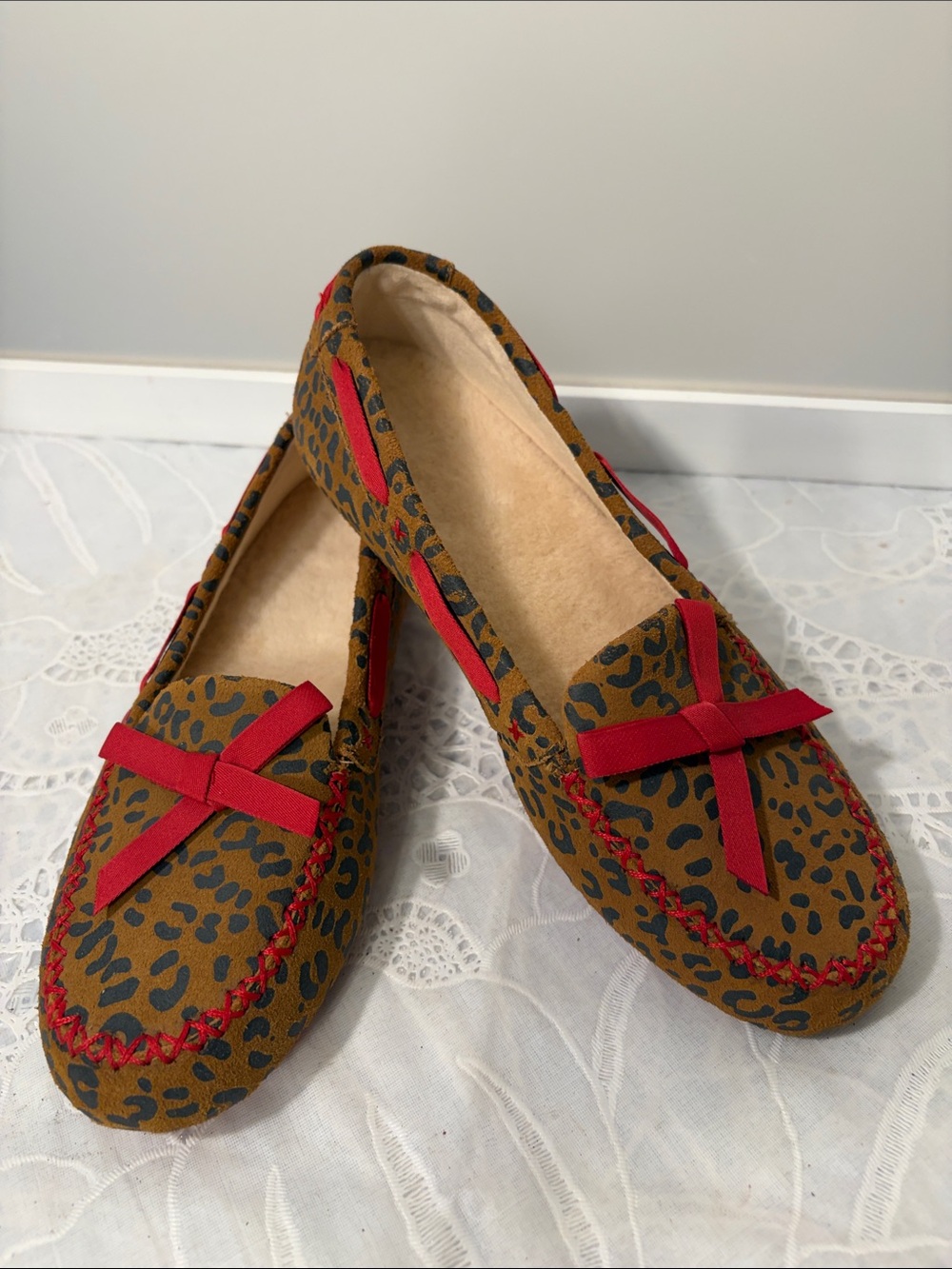 UGG Leopard Print Moccasins with Red Bow Accent